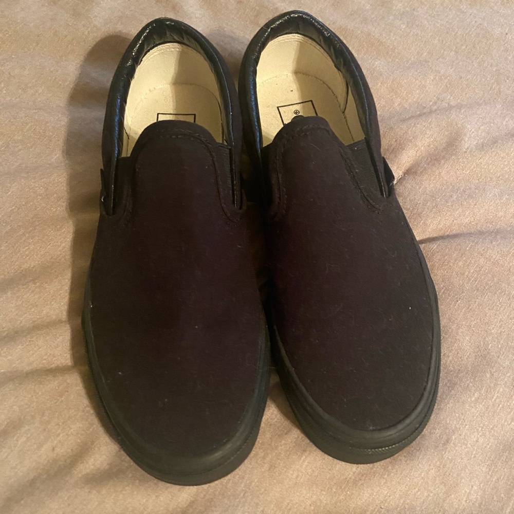 Vans all black slip ons. Never worn